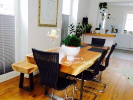 Esstisch mit einer Sitzbank aus einem Baumstamm Esstisch mit Sitzbank aus einem Baumstamm