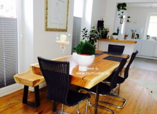 Esstisch mit einer Sitzbank aus einem Baumstamm Esstisch mit Sitzbank aus einem Baumstamm