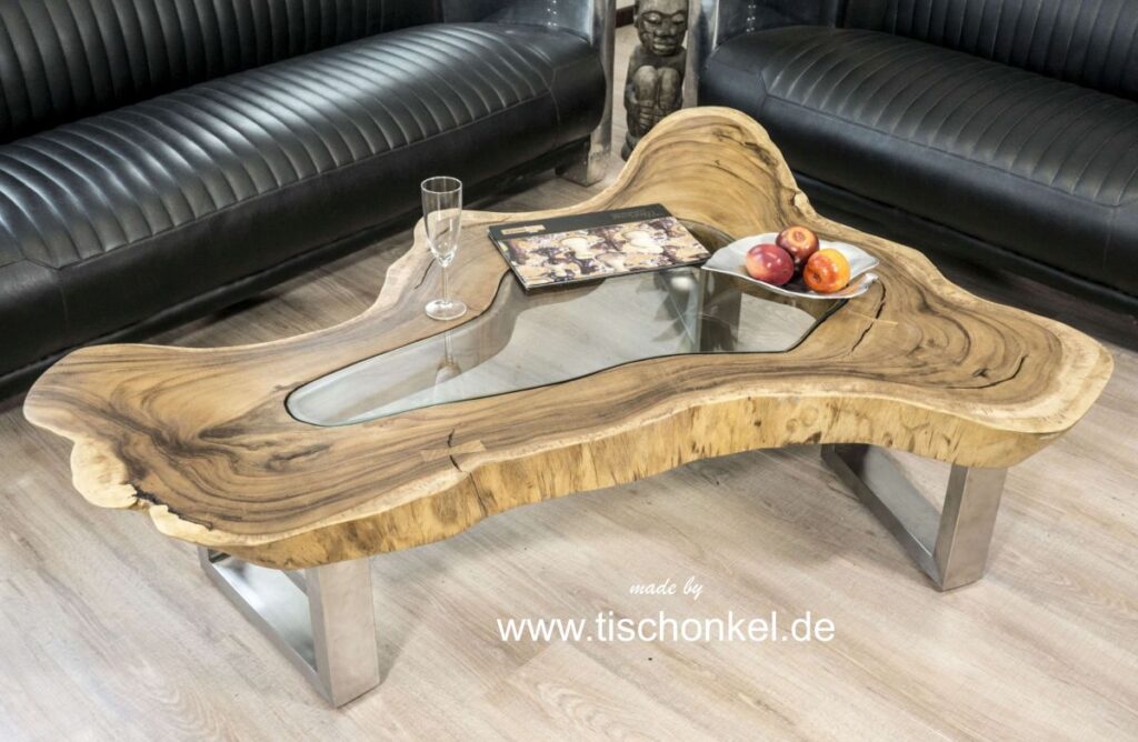 Außergewöhnlicher Couchtisch von "GERKEN Wohndesign" Couchtisch Clash mit Glasscheibe und einem Tischgestell aus gebürstetem Edelstahl aussergewöhnliches Design