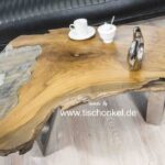 Couchtisch aus einem Baumstumpf Teak mit Glaseinleger und Tischgestell aus Edelstahl