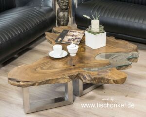 Couchtisch aus einer Baumscheibe Teak mit Edelstahlgestell und Glas