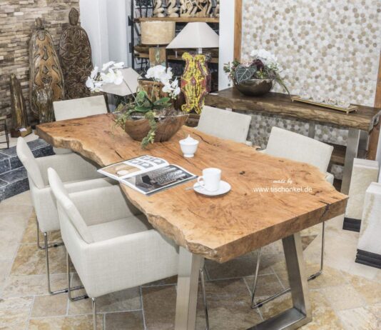 Solid dining table made from a wood slab Solid dining table made from a wood slab