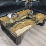 Couchtisch günstig mit Holz, Rohstahl und Glas