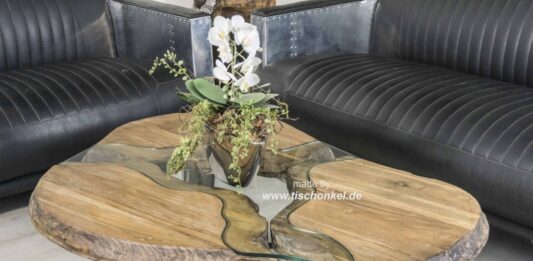 Teak Couchtisch auf stylischem Edelstahlgestell Teak Couchtisch auf Edelstahlgestell