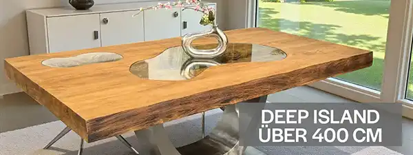 Massiver Esstisch „Deep Island“ aus Echtholz mit über 400 cm Länge für große Runden und repräsentative Tafeln. Handgefertigte Unikate jetzt auf tischonkel.de entdecken.