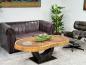 Preview: Massiver ovaler Couchtisch Baumstamm mit Metallgestell