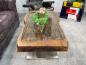Preview: Antique coffee table from rice mortar with glass top, metal base.