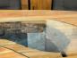 Preview: Ovaler Designtisch aus Massivholz und vollmassiver Tischplatte