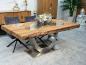 Preview: Esstisch aus Altholz mit Edelstahlgestell und Glaseinlage.