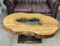 Preview: Organic oval wooden coffee table with glass top and vase.