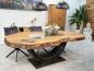 Preview: Massiver Holztisch aus recyceltem Holz mit Rohstahlgestell.