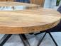 Preview: Round dining table made of recycled wood with glass and steel frame.
