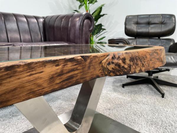 Antique coffee table from rice mortar, wooden top, metal legs.