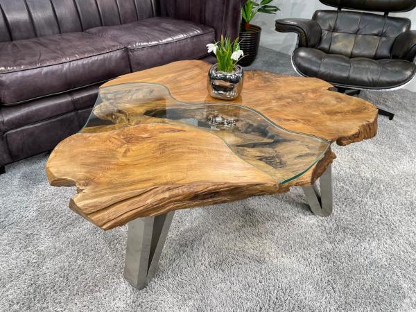 Tree trunk coffee table with glass top and black legs