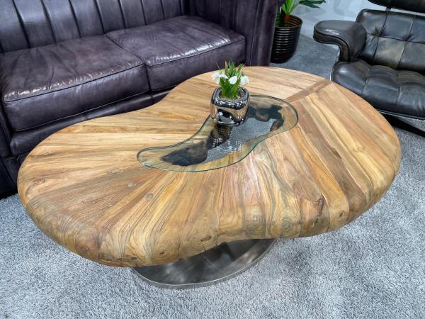 Kidney-shaped wooden coffee table with glass and steel frame.
