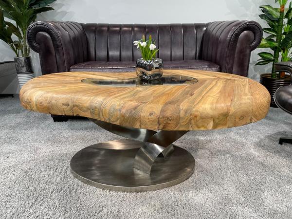 Bonsai coffee table with wooden top and stainless steel base.