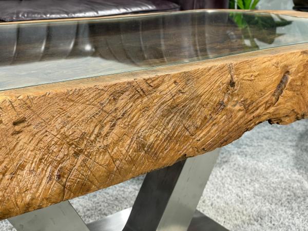 Coffee table from antique rice mortar with glass top, metal legs