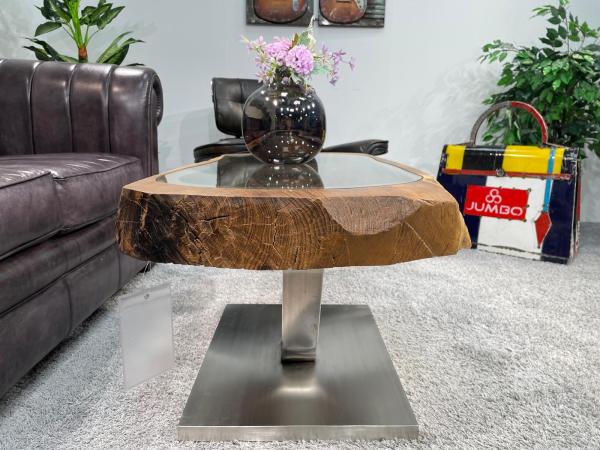 Coffee table from antique rice mortar, approx. 109x52x51 cm, in front of sofa.