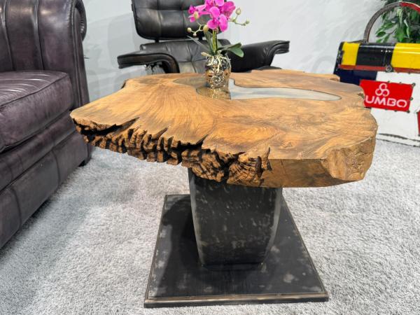 Coffee table made of solid wood with glass inlay, irregular shape.