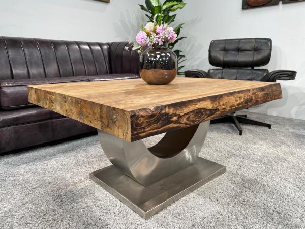 Solid wood coffee table made from recycled teak on metal base.
