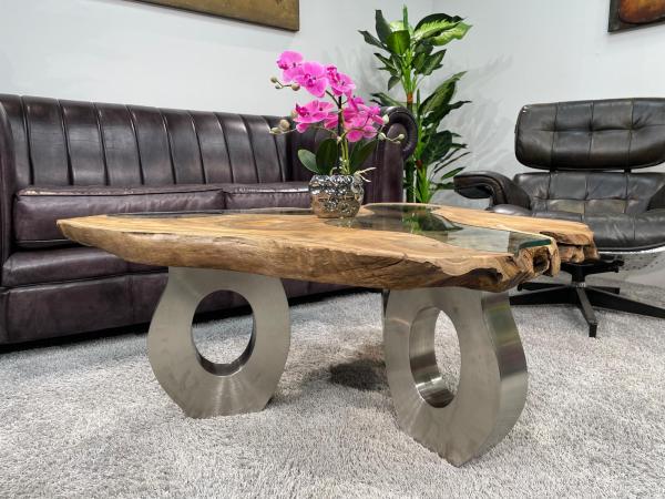Coffee table with glass inlays and O-shaped steel legs