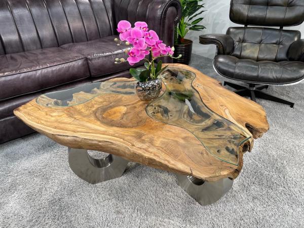 Coffee table with glass inlays and O-shaped steel legs.