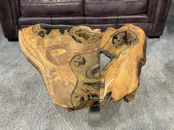 Coffee table with glass inlays and O-shaped steel legs.
