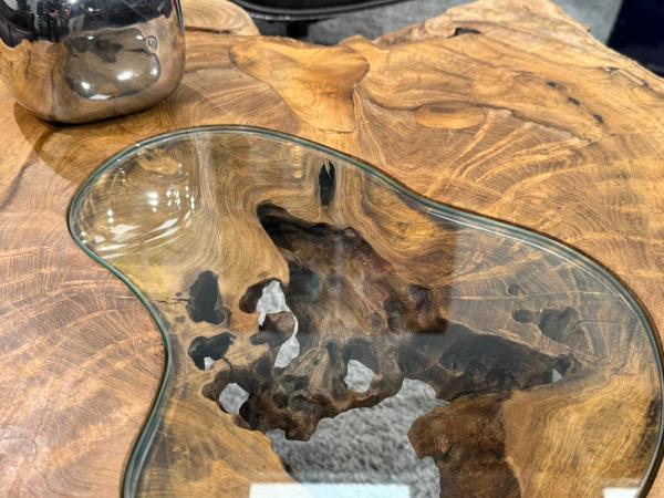 Log table with glass top, 90x75x45 cm, in living room.