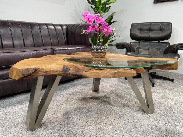 Log coffee table with glass top and metal legs.