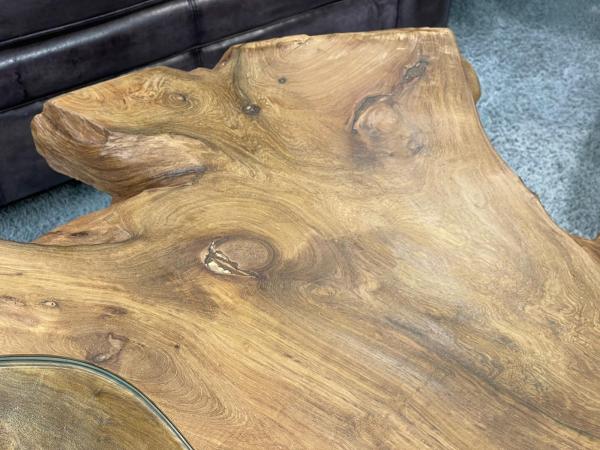 Wooden log coffee table, irregular shape, natural finish.