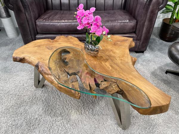 Log coffee table with glass top, orchid on it
