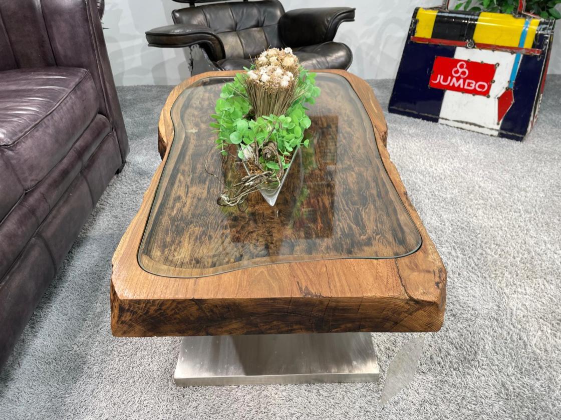 Antique coffee table from rice mortar with glass top, metal base.
