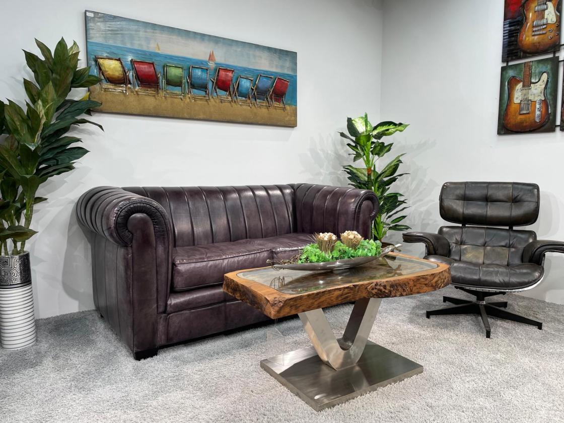 Antique coffee table from rice mortar with hole in center.