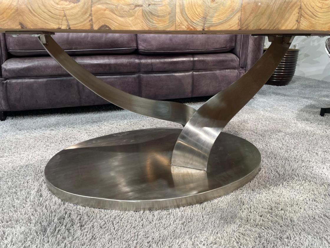 Coffee table with stainless steel frame and oval base