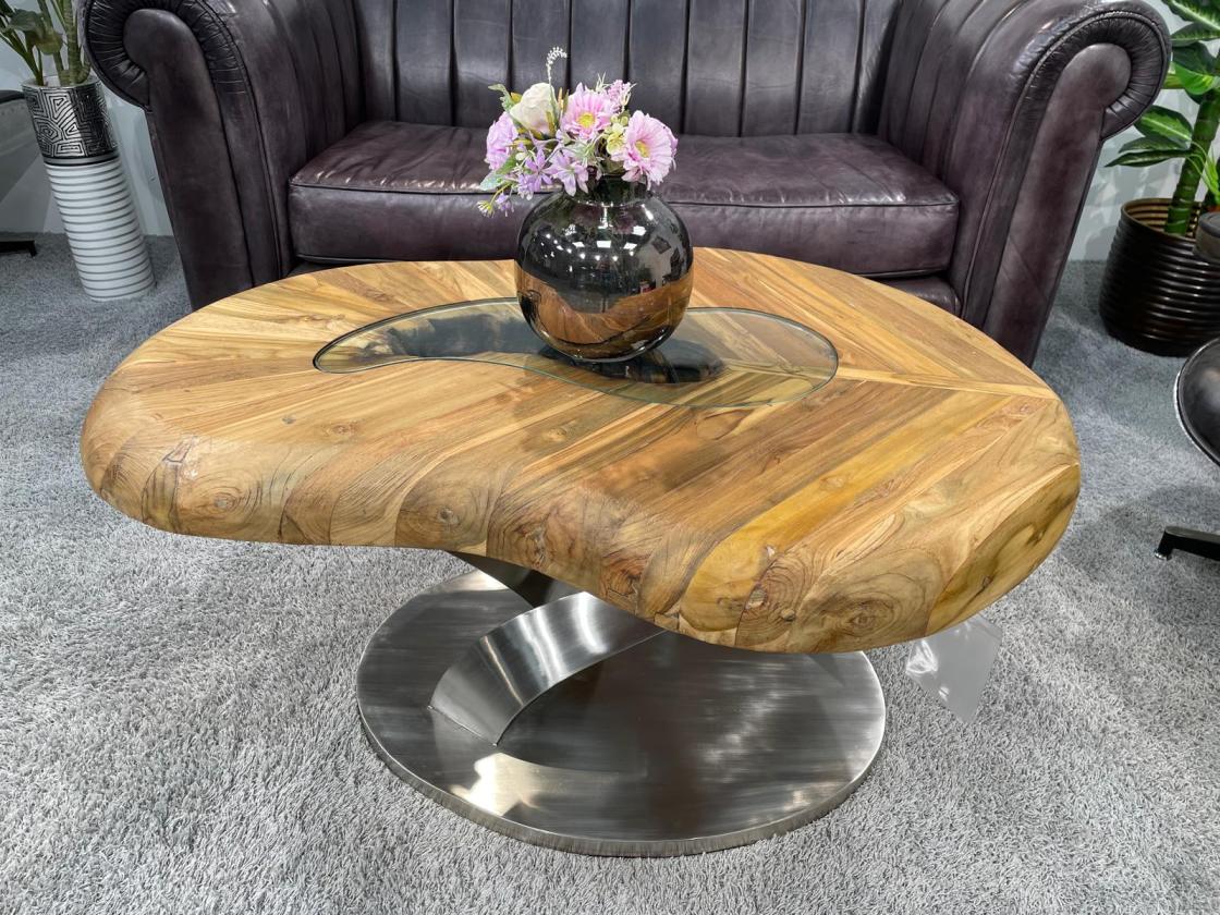 Living room table with wooden top and stainless steel base.
