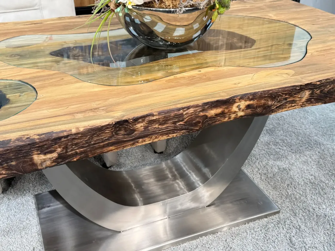 Solid wood dining table with glass inlays and metal base.