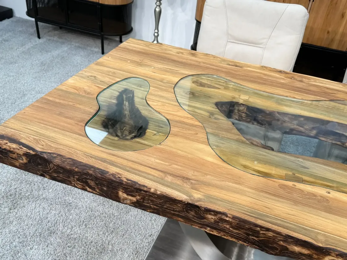 Solid wood dining table with glass inlays, seats 6 people.