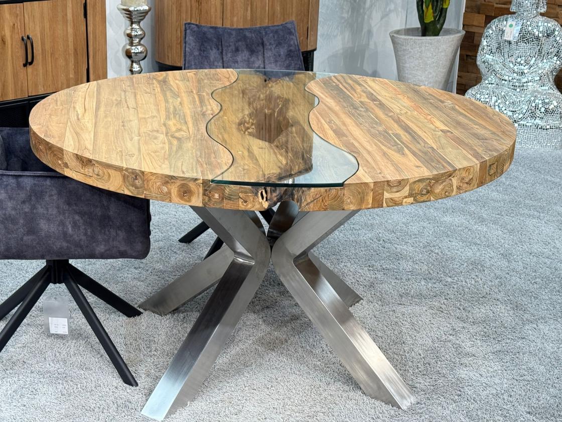 Round dining table made of recycled wood, stainless steel base, glass insert.