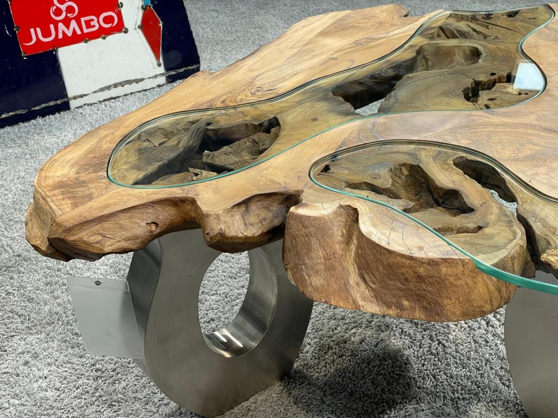 Coffee table with glass inlay and O-shaped steel legs.