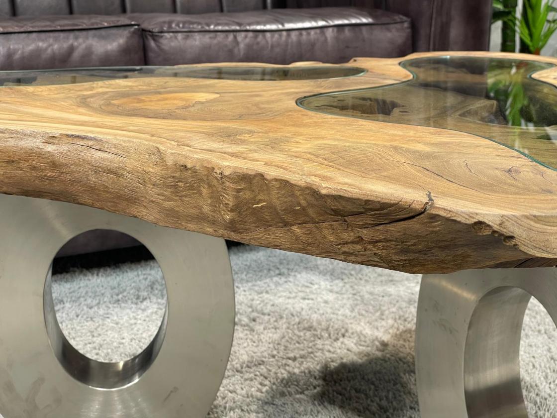 Coffee table with glass inlays and O-shaped steel legs