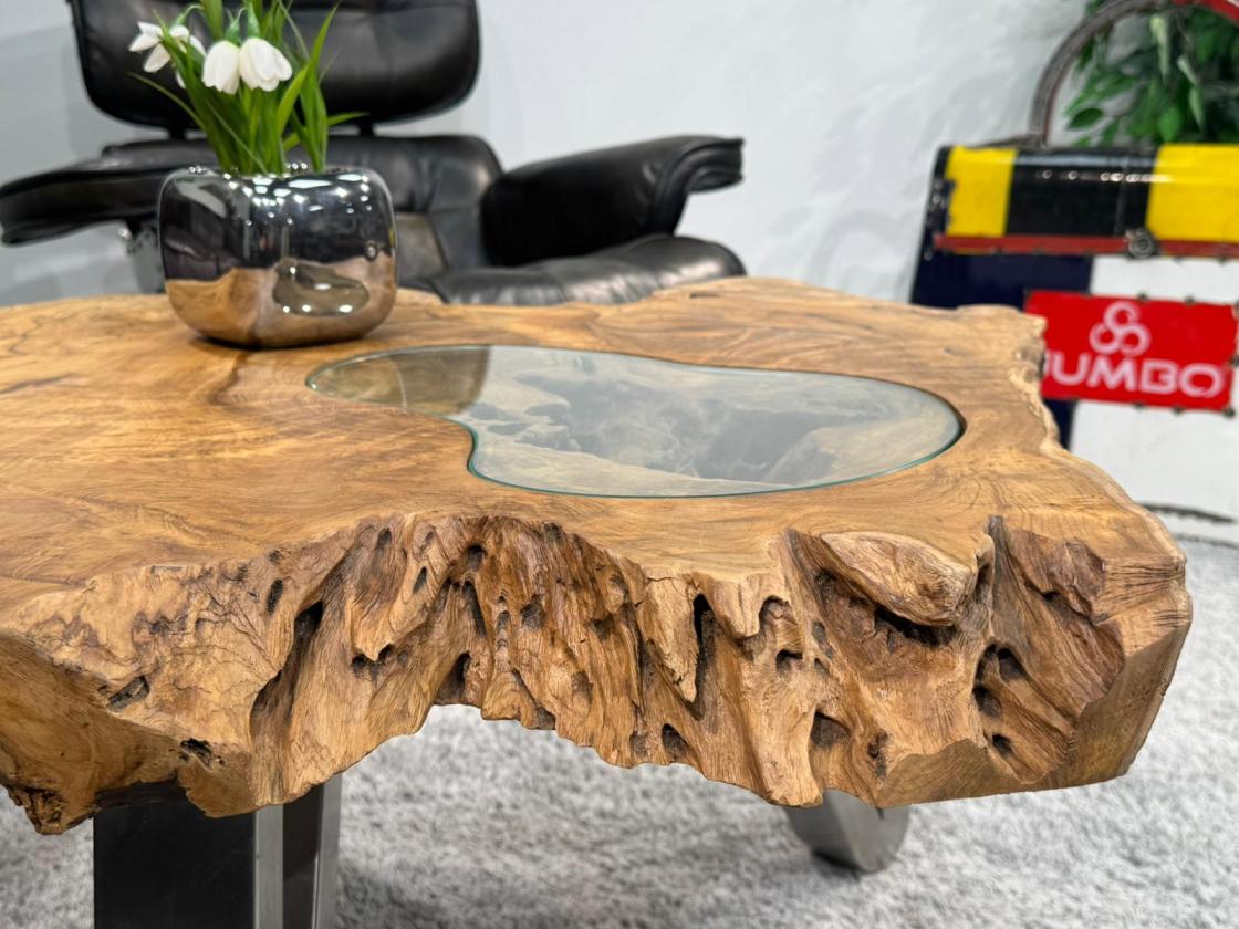 Log table with glass top, 90x75x45 cm, in living room.