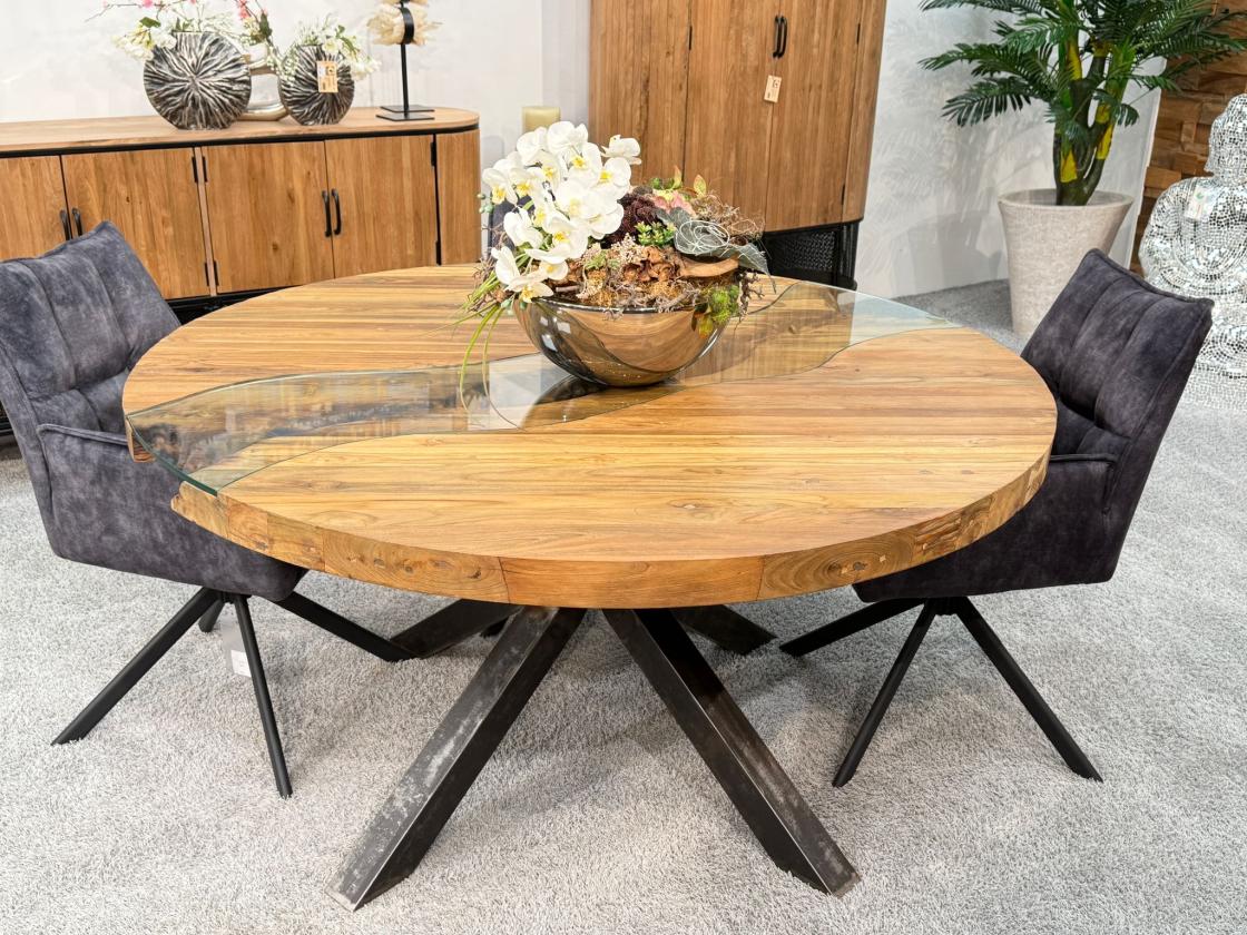 Round dining table made of recycled wood with glass and steel frame.