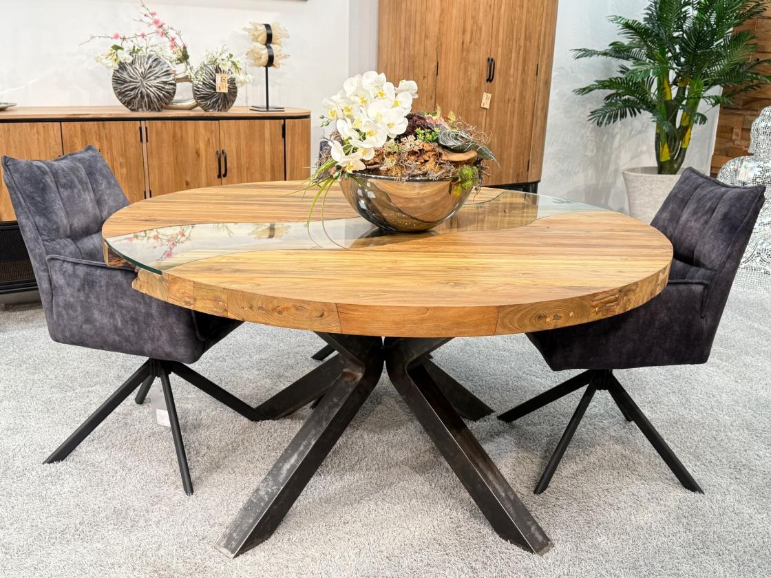 Round dining table made of recycled wood with glass and steel base