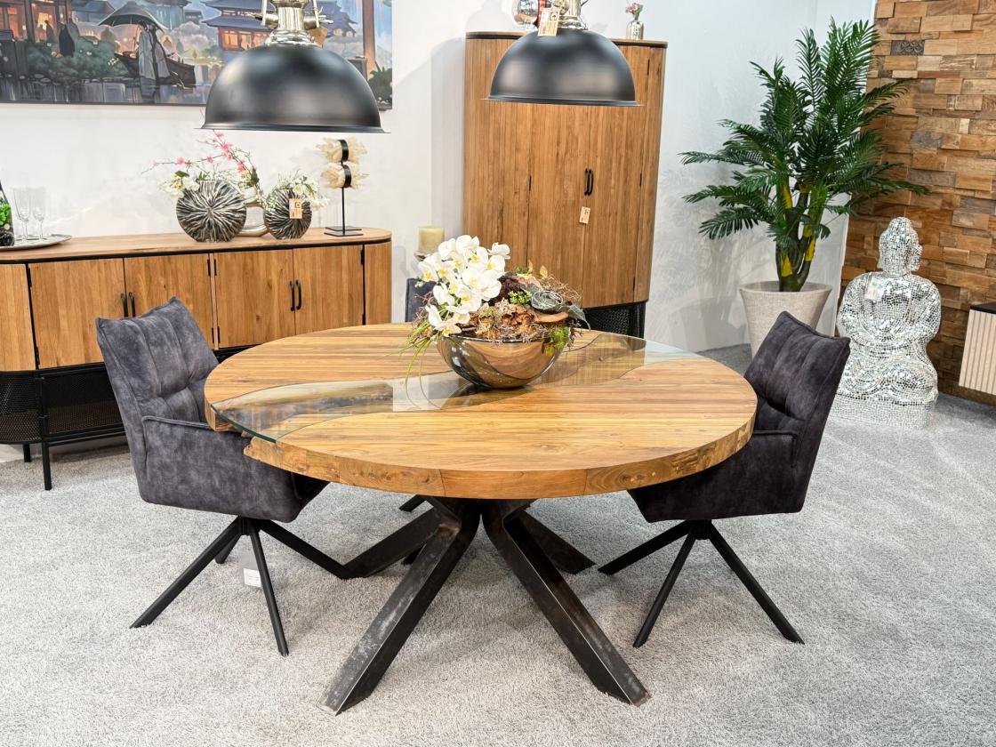 Round dining table made of recycled wood with glass and steel frame.